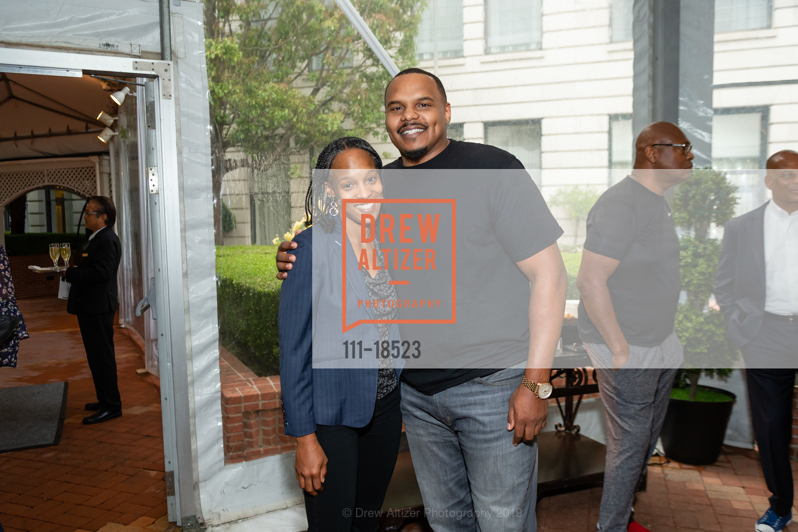 Nyaka Niilampti, Chester Pitts, UCSF Health Celebrity Golf Classic 2019 Welcome Reception, Ritz Carlton. 600 Stockton Street, May 19th, 2019, Photo #111-18523 Nyaka Niilampti, Chester Pitts, Photo #111-18523
