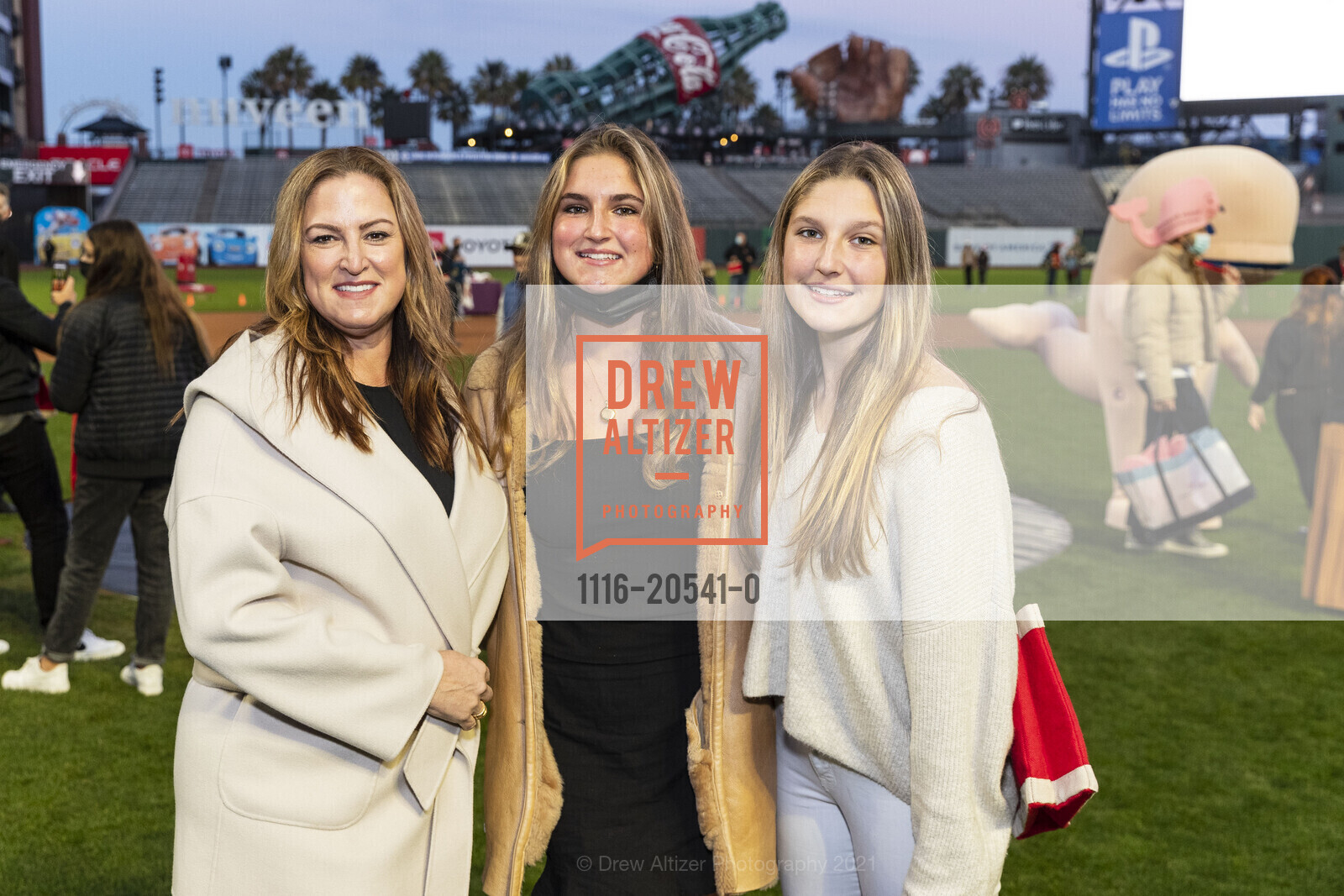 Jessica Grimes, Sophia Frushtick, Chloe Frushtick, Holiday Heroes, 24 Willie Mays Plaza. 24 Willie Mays Plaza, December 7th, 2021, Photo #1116-20541-0 Jessica Grimes, Sophia Frushtick, Chloe Frushtick, Photo #1116-20541-0