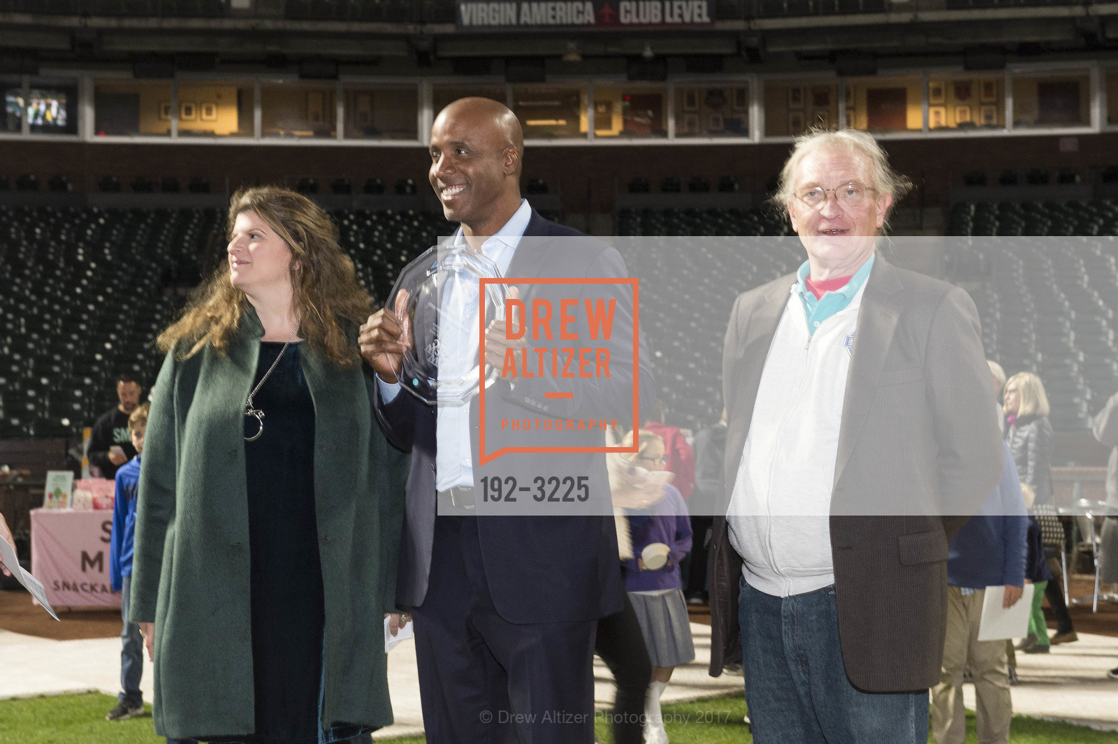 Amy Wender-Hoch, Barry Bonds, Mike Herbst, Holiday Heroes 2017, AT&T Park. 24 Willie Mays Plaza, San Francisco, CA, December 5th, 2017, Photo #192-3225 Amy Wender-Hoch, Barry Bonds, Mike Herbst, Photo #192-3225